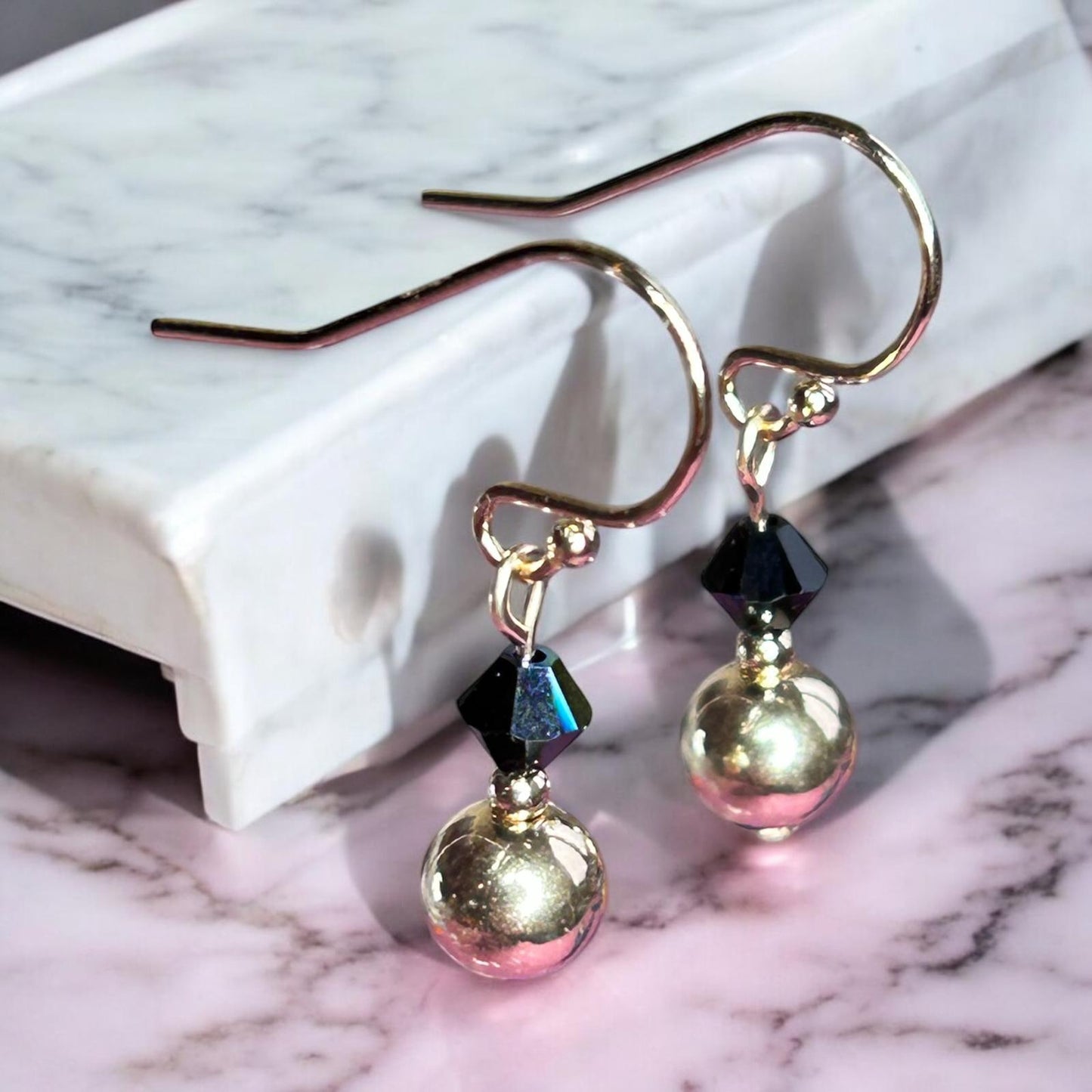 Swarovski X earrings.