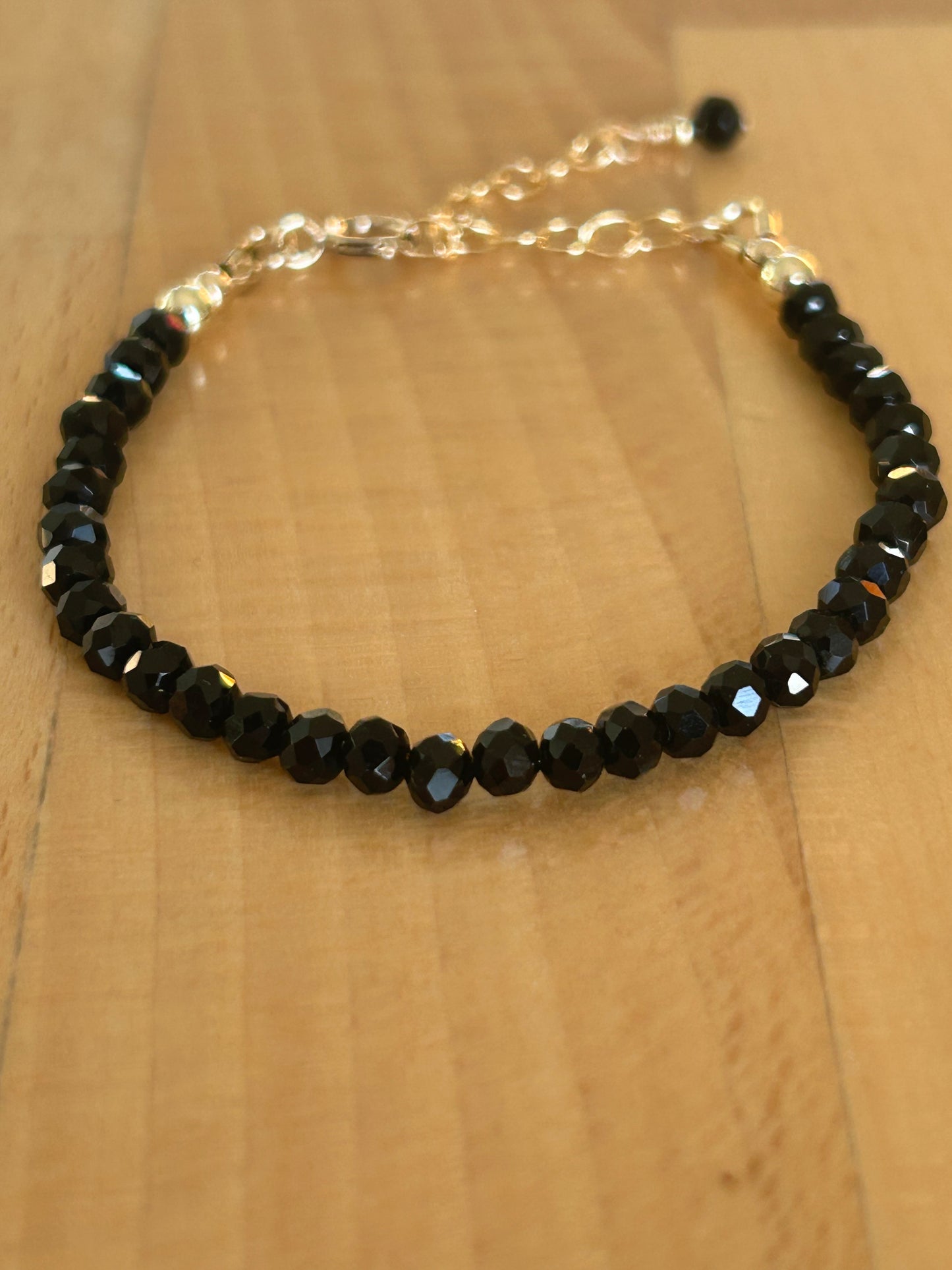 Black Rondel and Gold bracelet