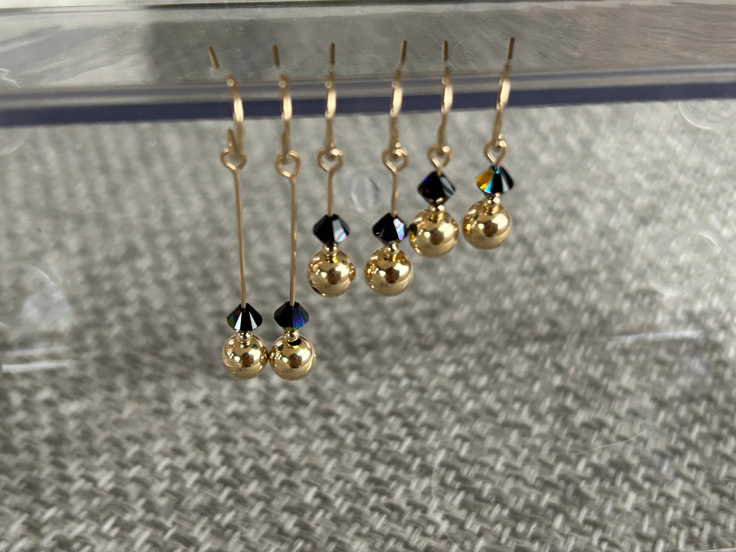 Swarovski X earrings.