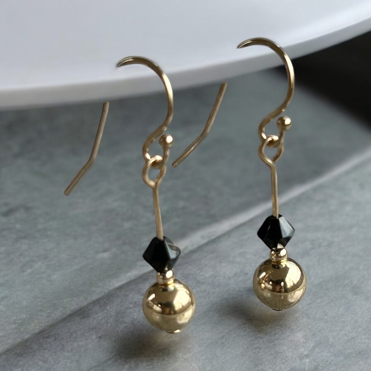 Swarovski X earrings.