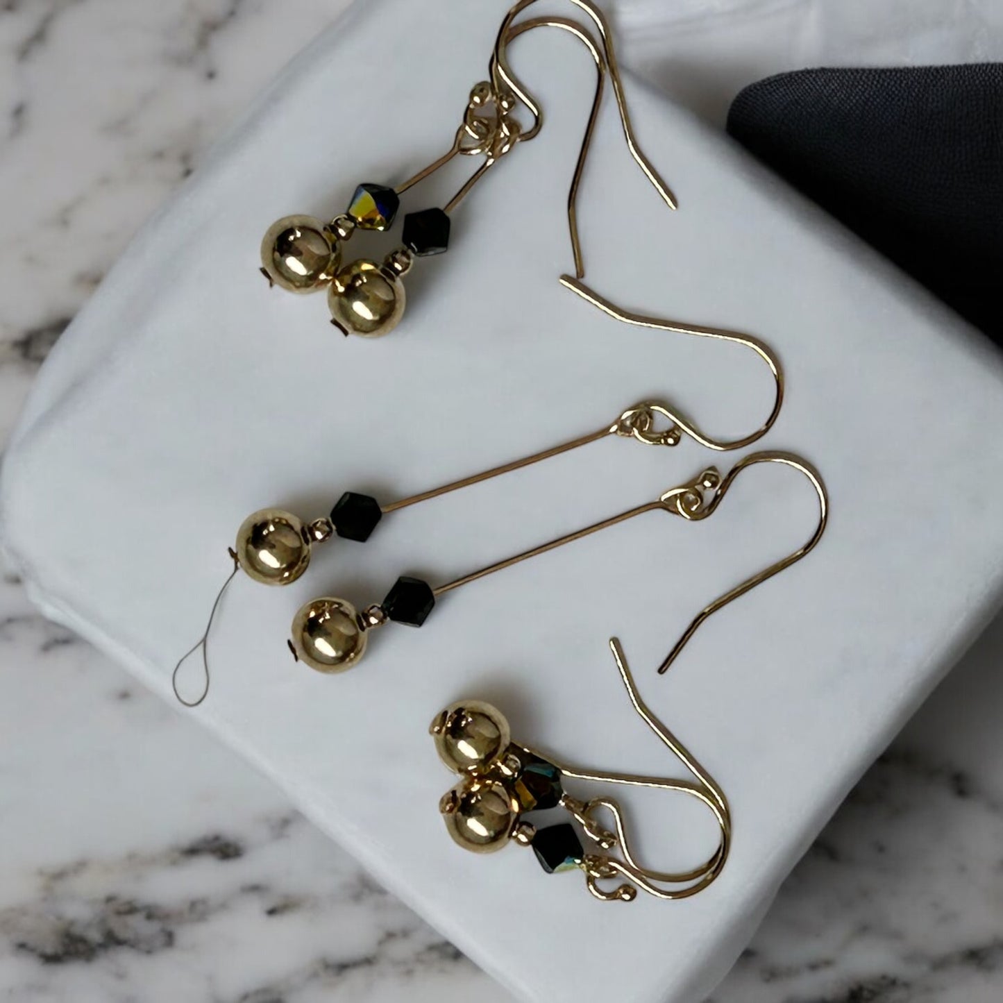 Swarovski X earrings.